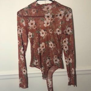 Medium see through low turtle neck body suit